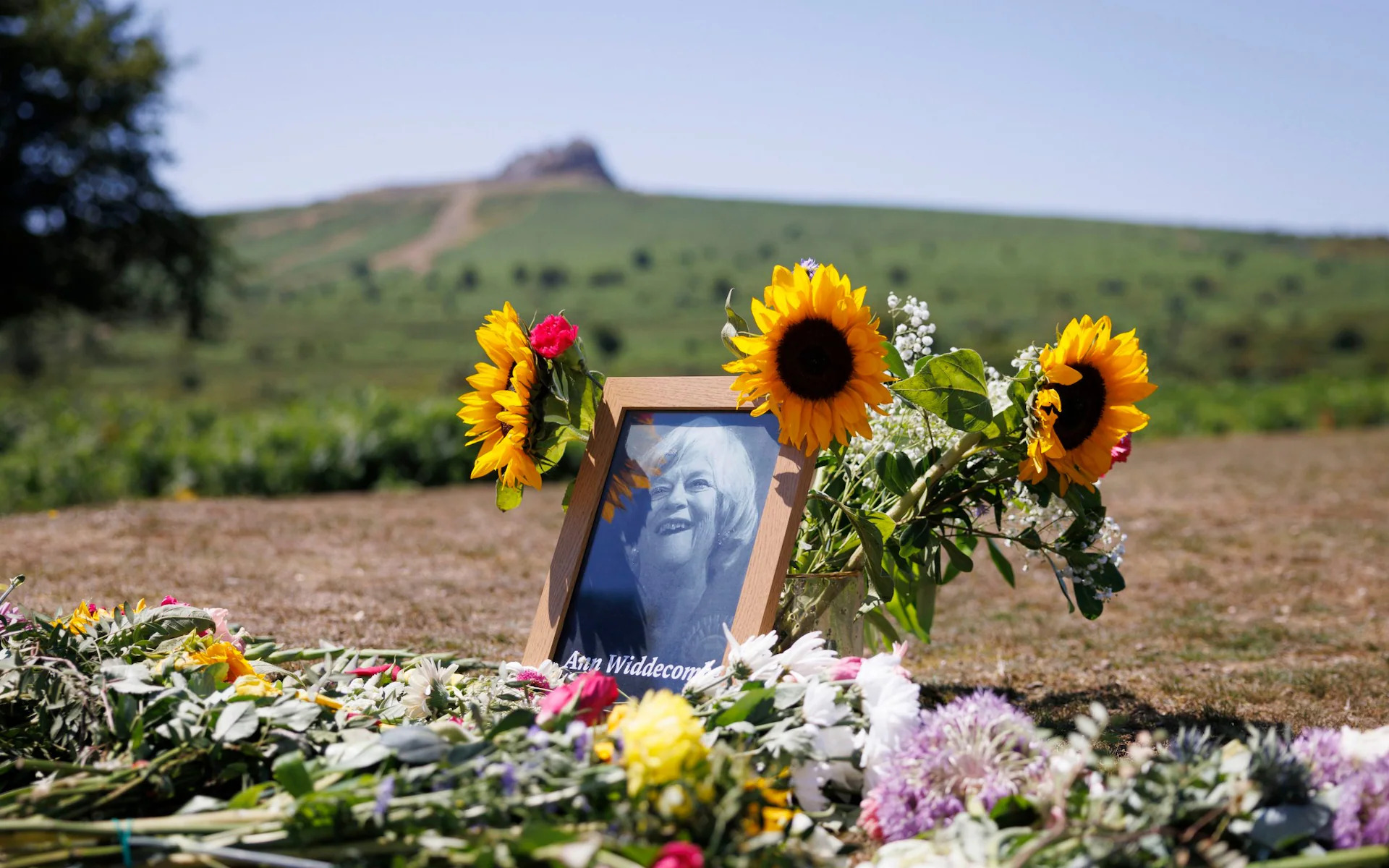 Memorial flowers and a framed photograph of Ann Widdecombe